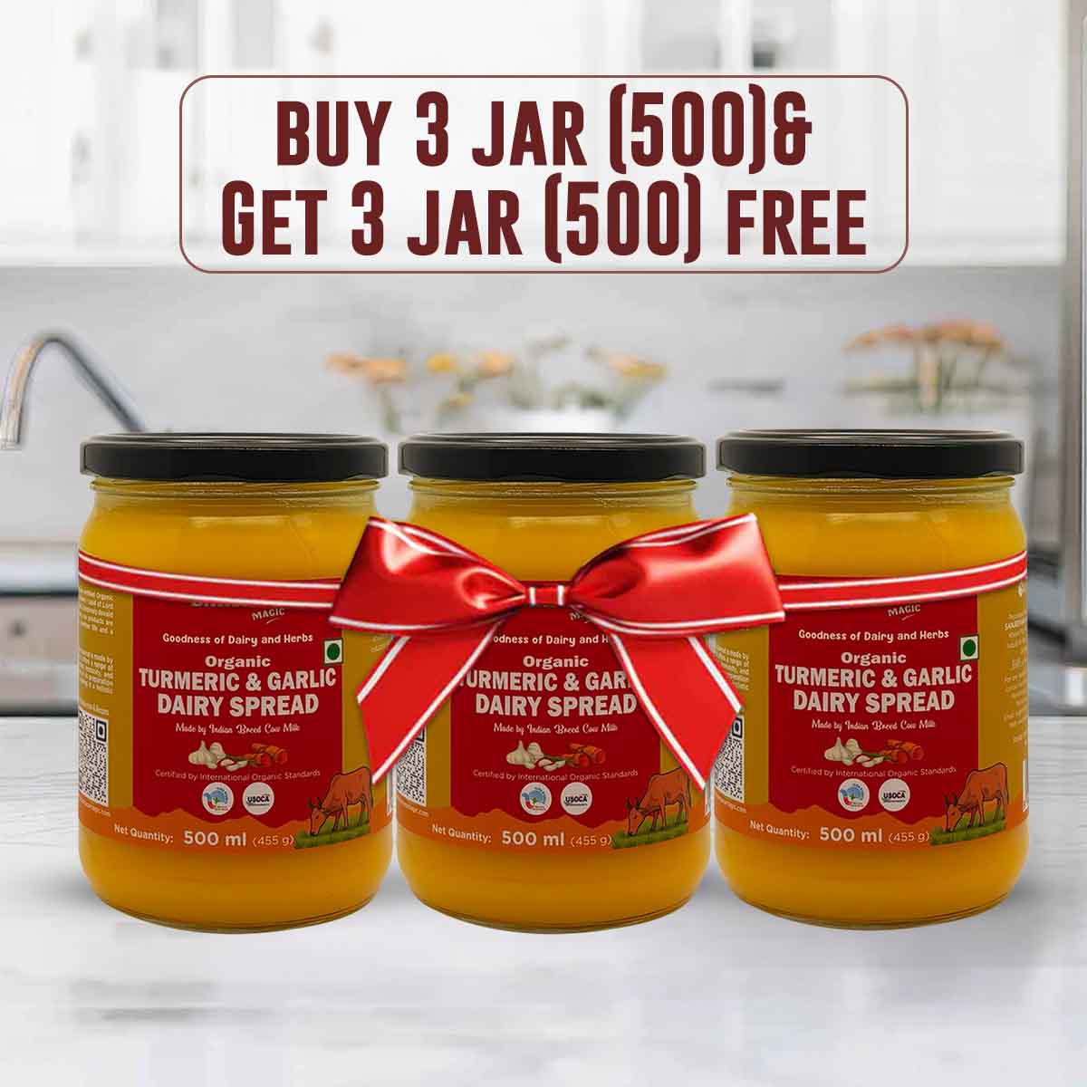 Barsana Magic and Three jars of Turmeric & Garlic Dairy Spread with a red bow on a kitchen counter.