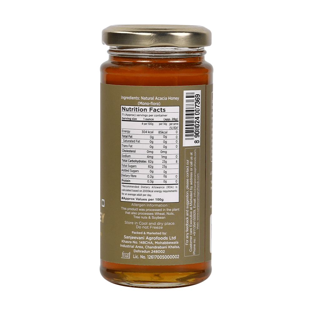 Golden Natural Acacia Honey in a clear jar, showcasing its pale, translucent hue and smooth, syrupy texture.