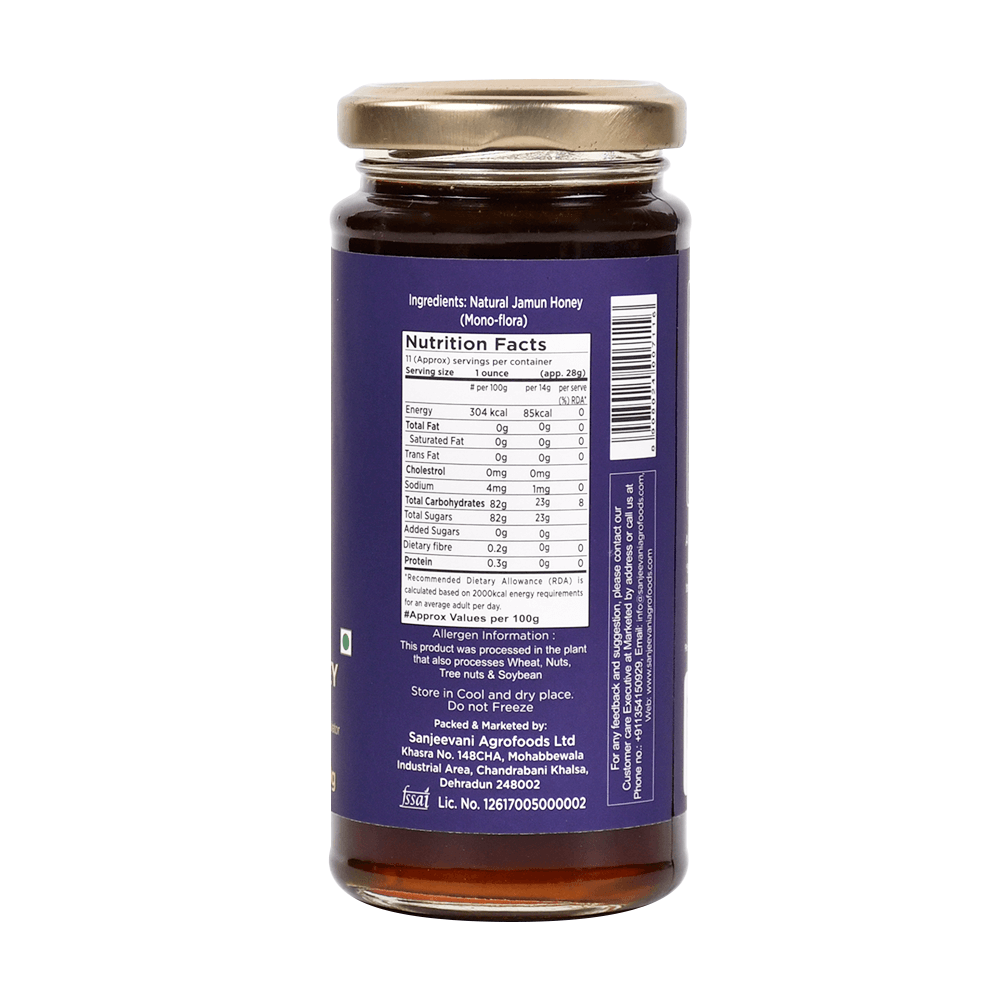 Pure Sanjeevani Organics Jamun Honey in a clear glass jar, showcasing its rich, golden-amber hue and smooth, glossy texture.