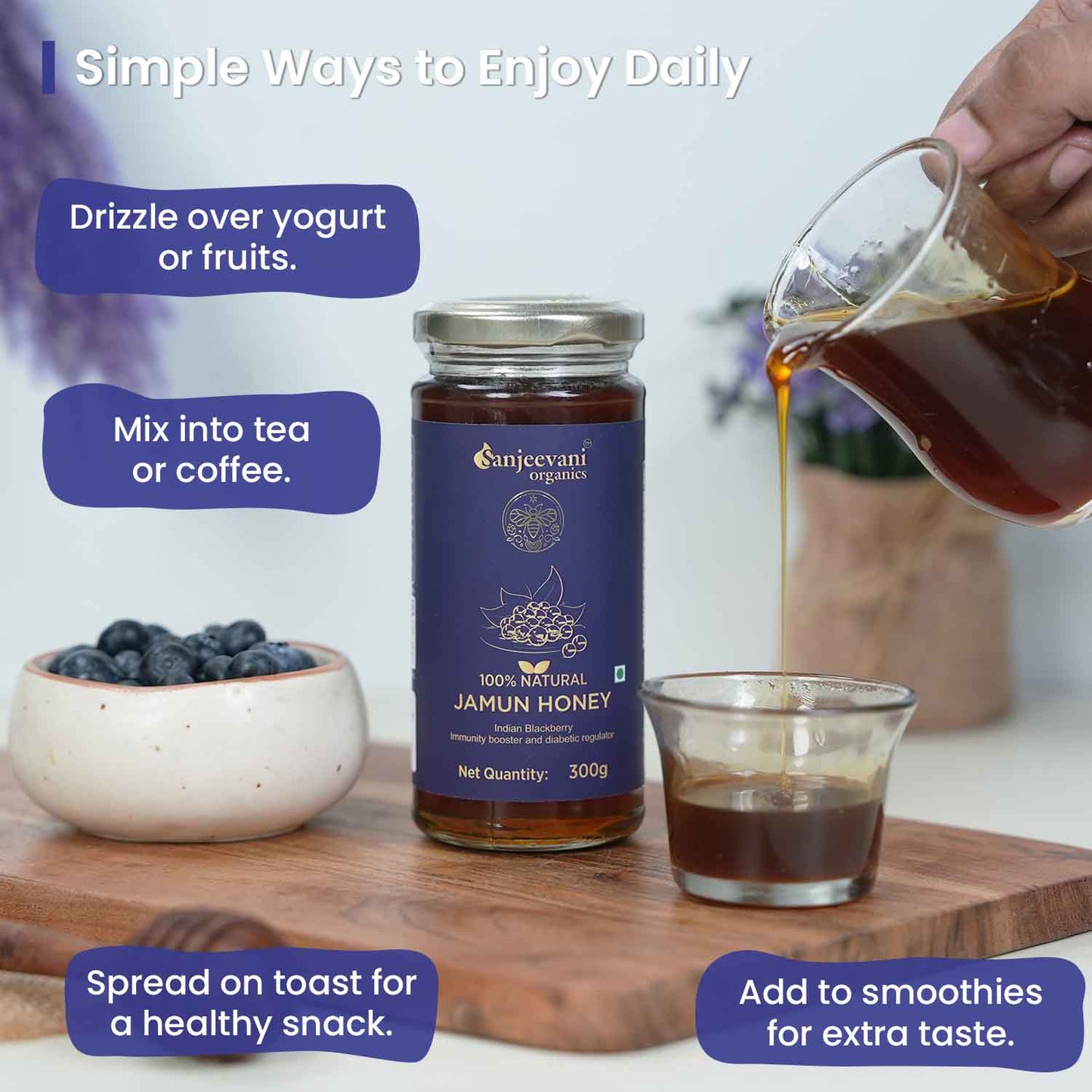 Pure Sanjeevani Organics Jamun Honey in a clear glass jar, showcasing its rich, golden-amber hue and smooth, syrupy texture.