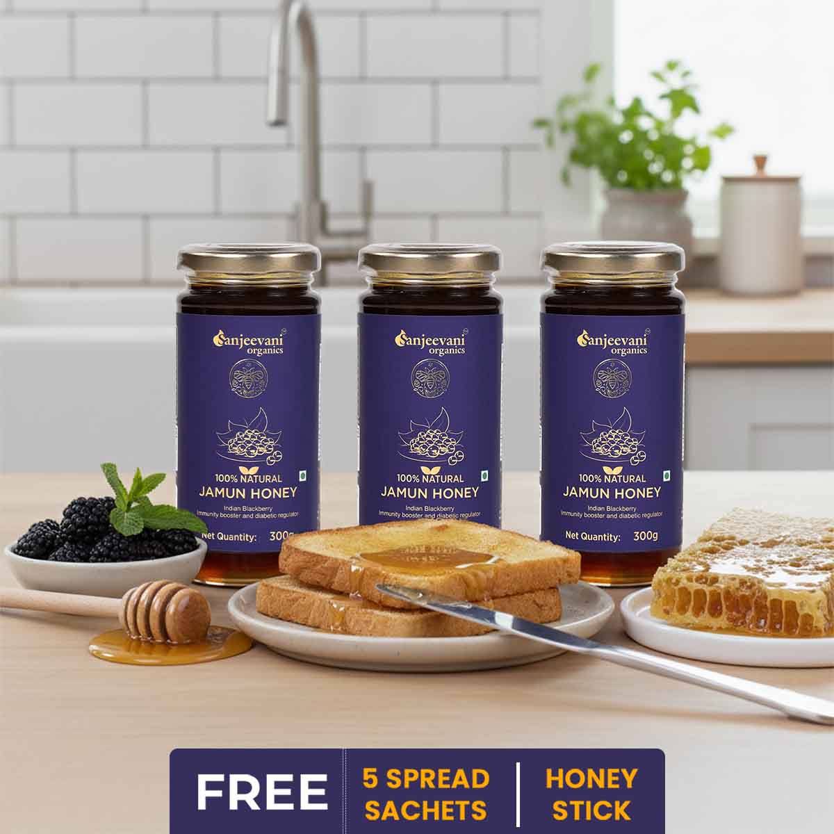 Barsana Magic and Three jars of Sanjeevani Organics Jamun Honey on a kitchen counter with toast and honey.
