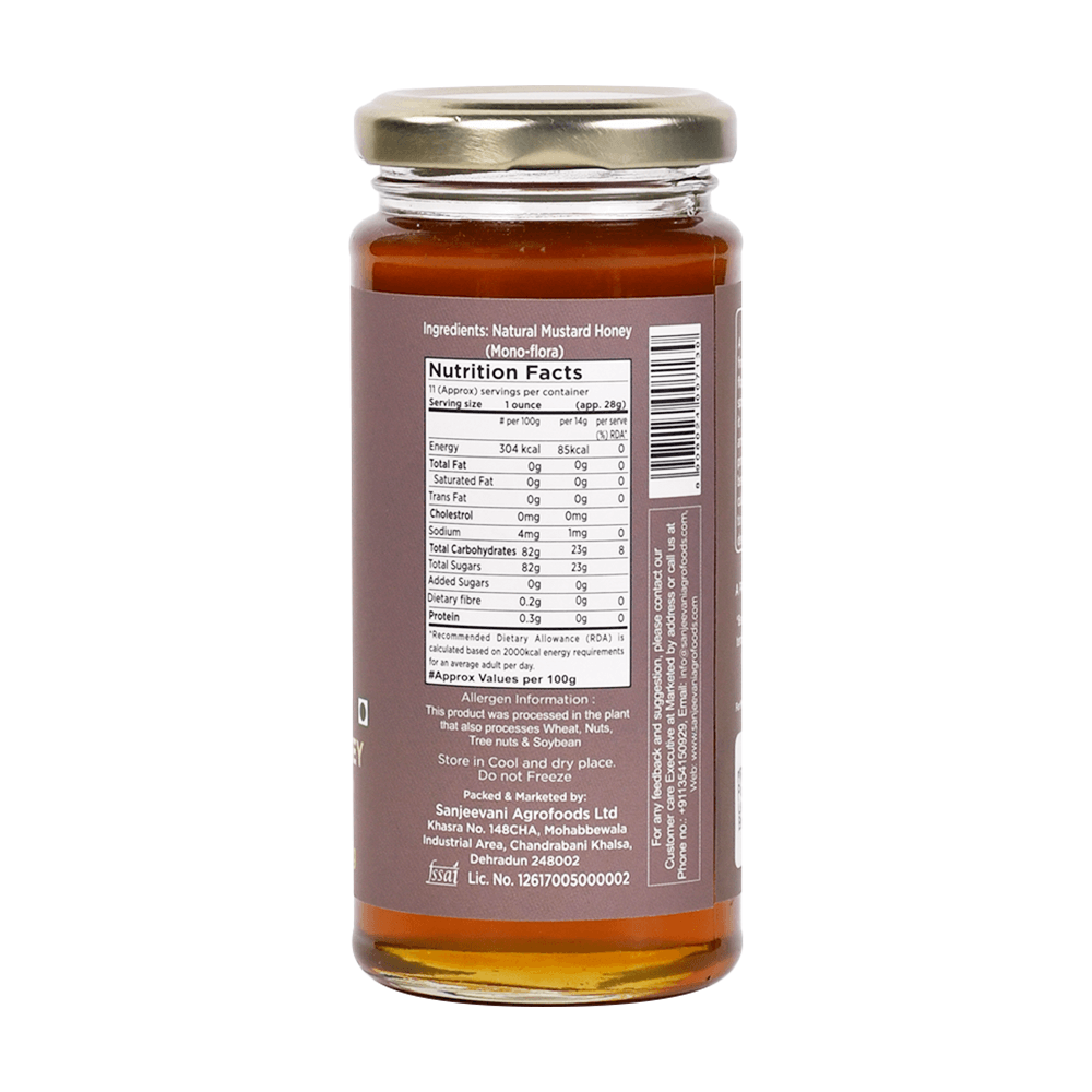 Bright golden Natural Mustard Honey in a glass jar, reflecting the vibrant yellow of mustard flowers from India's fields.