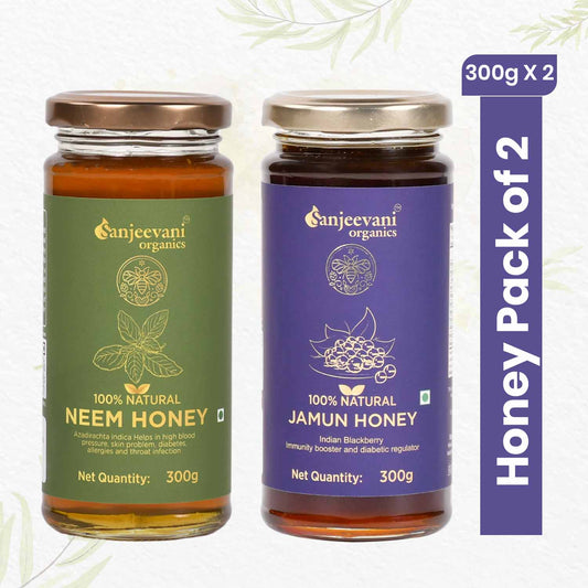 Pure Sanjeevani Organics Jamun and Neem Honey duo in glass jars, showcasing golden and amber hues of natural sweetness.