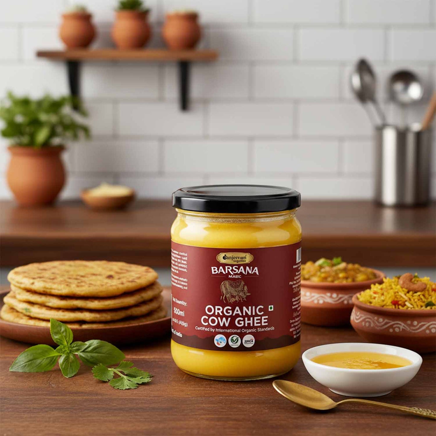 Barsana  Magic and Jar of Organic Cow Ghee on a kitchen counter with food items in the background