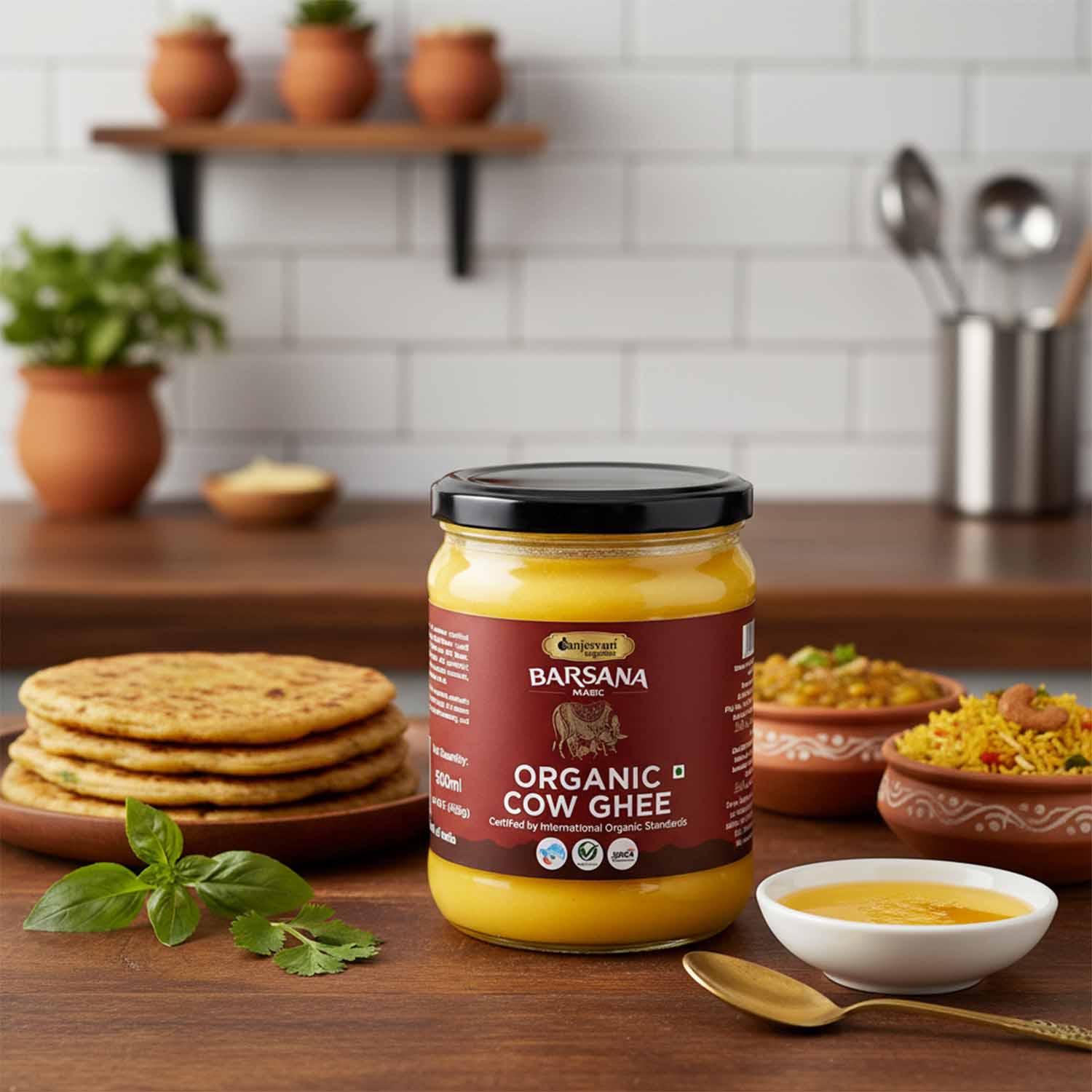 Barsana  Magic and Jar of Organic Cow Ghee on a kitchen counter with food items in the background