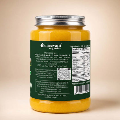 Barsana Magic and A jar of Sanjevani Organics milk-based chutney shown from the back, featuring a dark green label with white text, a silver metal lid, and a yellow-orange chutney visible at the top and bottom, set against a solid beige background.