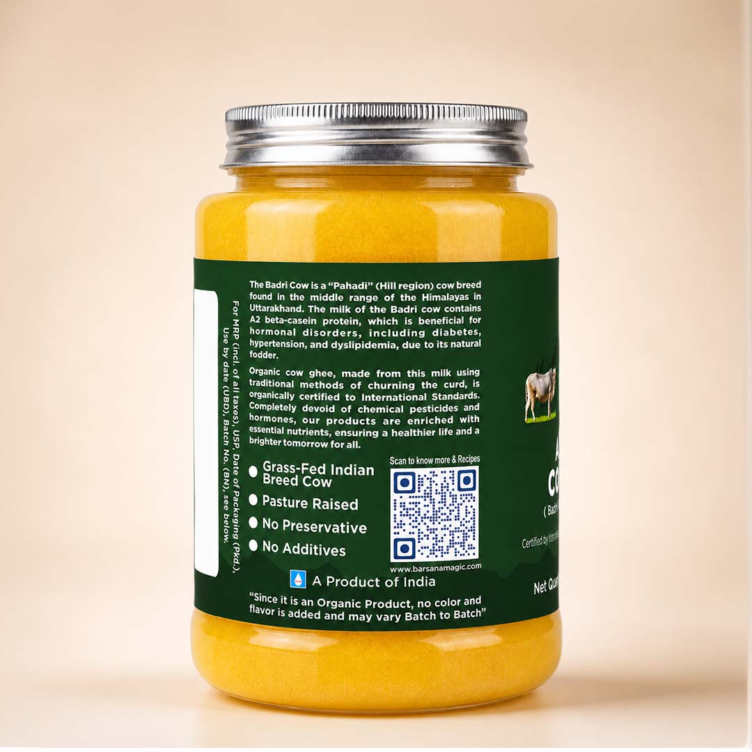 Barsana Magic and A jar of Badii Cow organic cow milk powder with a silver metal lid and a dark green label, set against a solid beige background.