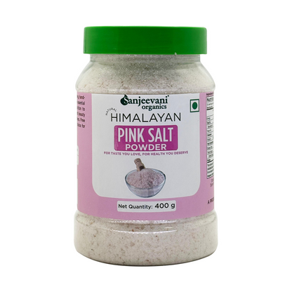 Barsana Magic and  Jar of himalayan pink salt powder with a green lid on a white background