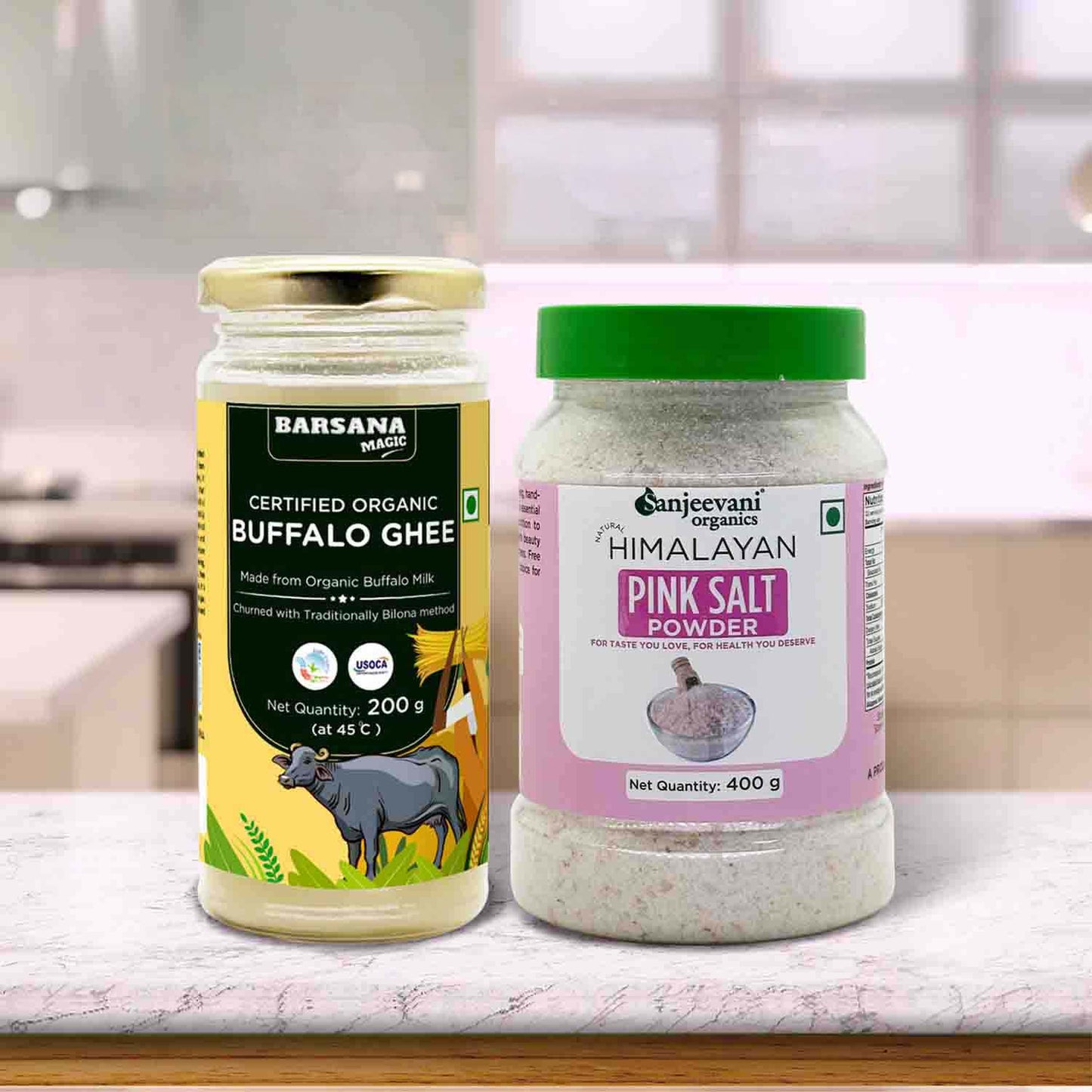 Barsana Magic and Two containers of Buffalo Ghee and Sanjeevani Himalayan Pink Salt Powder on a kitchen counter.