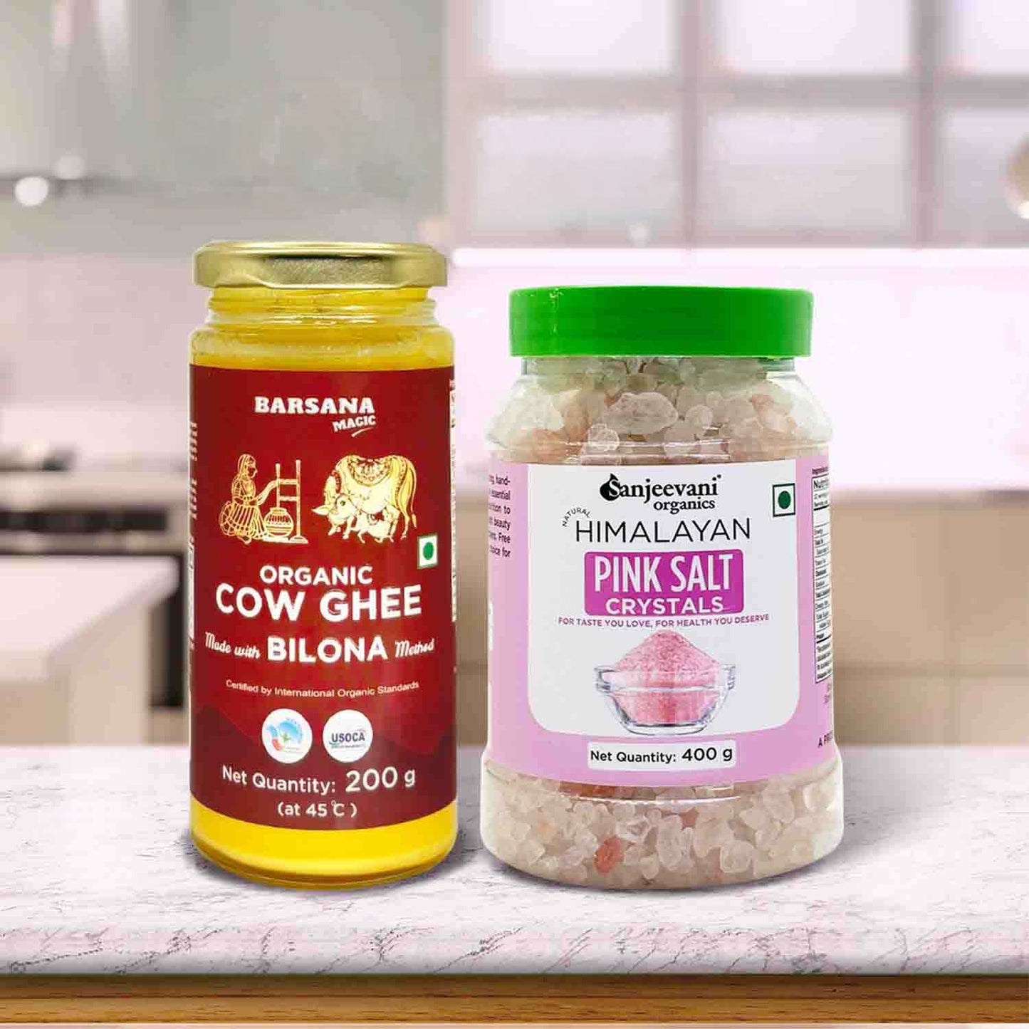 Barsana Magic and Two jars of organic cow ghee and Himalayan pink salt on a kitchen counter.