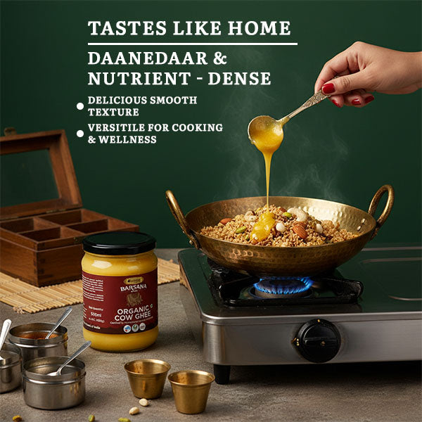 Barsana Magic and Hand pouring a spoonful of yellow substance into a pan with cooking ingredients, jar of organic cow ghee on stove.