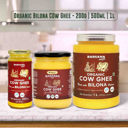 Barsana Magic and Three jars of Barsana Organic Cow Ghee with different capacities on a kitchen counter.