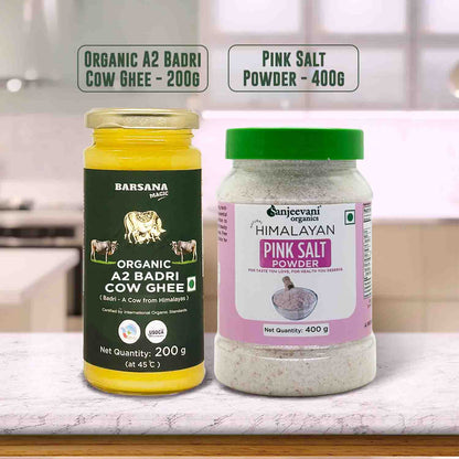 Barsana  Magic and Two containers of organic cow ghee and pink salt powder on a kitchen counter.