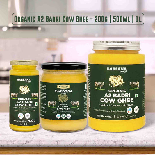 Barsana Magic and Three jars of Barsana Organic A2 Badri Cow Ghee on a kitchen counter.
