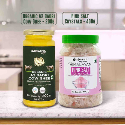 Barsana Magic and Two jars of organic ghee and pink salt crystals on a kitchen counter