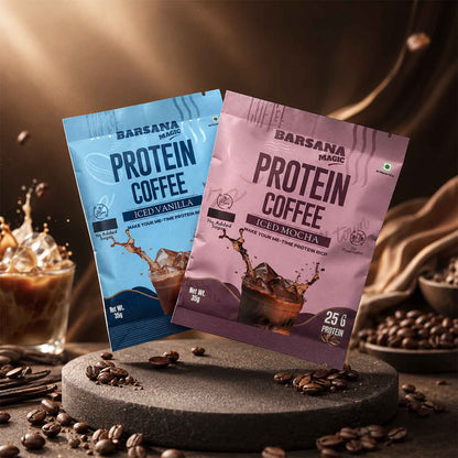 Barsana Magic and Two packages of Protein Coffee, one blue and one pink, on a dark surface with coffee beans and a blurred background.