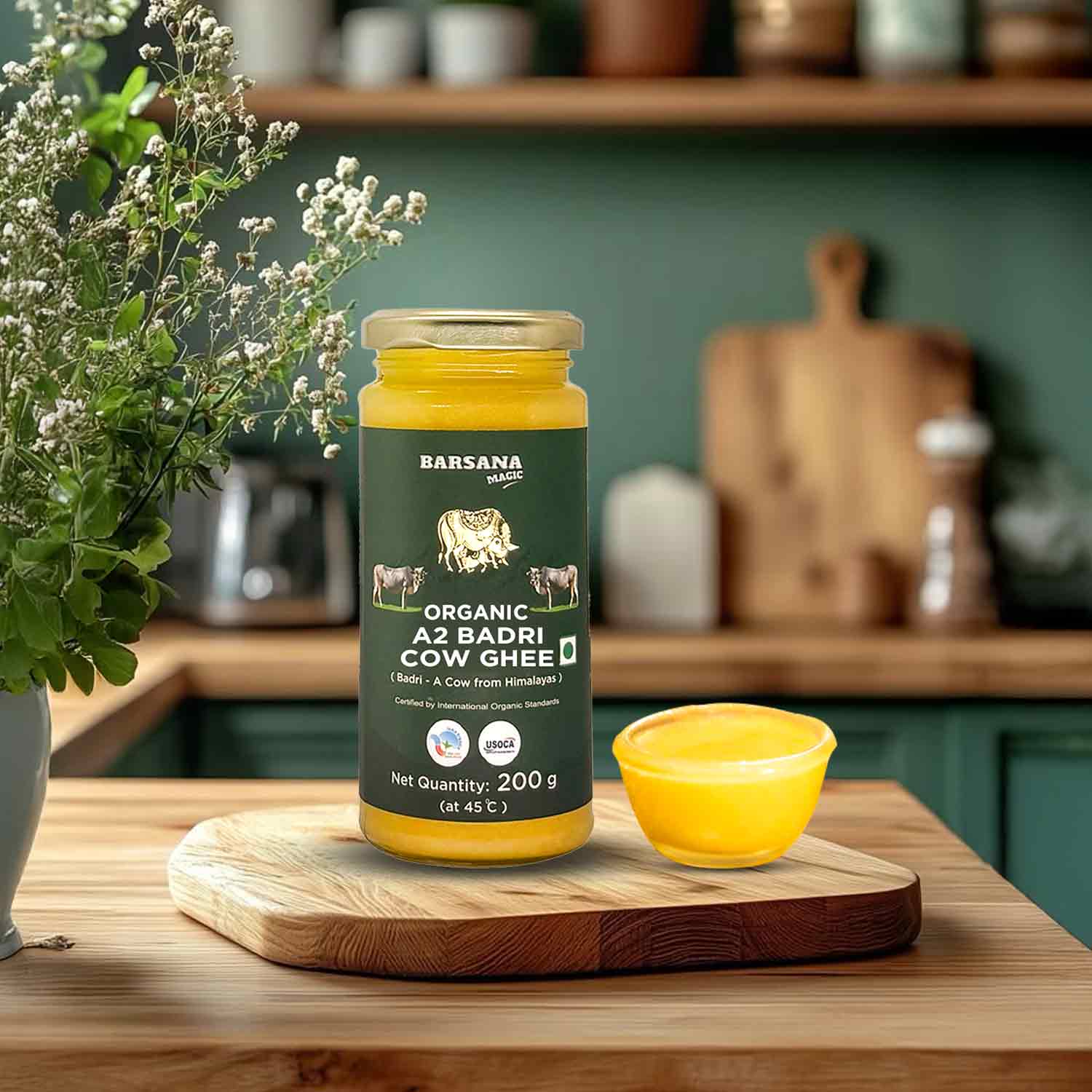 Barsana Magic and  Jar of Barsana Organic A2 Badri Cow Ghee on a wooden cutting board with a bowl of ghee, surrounded by kitchen items.