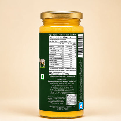 Barsana Magic and A glass jar of cow milk cheese spread with a gold lid and a dark green label showing the nutrition facts, set against a solid beige background.