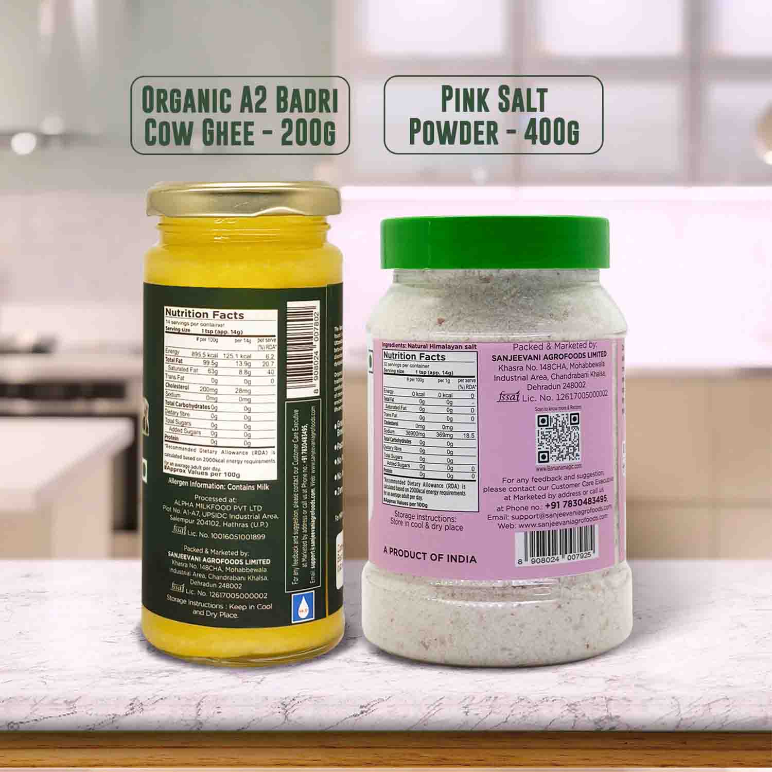 Barsana  Magic and Two containers labeled 'Organic A2 Badri Cow Ghee' and 'Pink Salt Powder' on a kitchen counter.