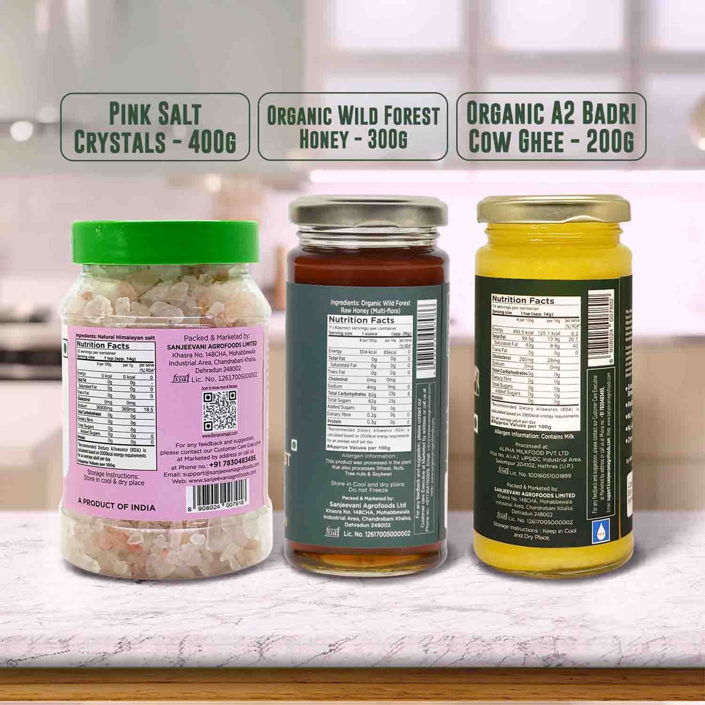 Barsana Magic and Three jars of different products with labels on a kitchen counter.