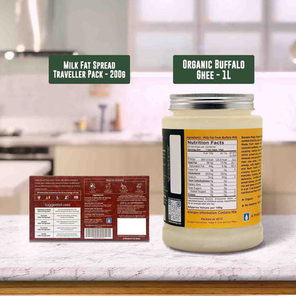 Barsana Magic and Jars of milk fat spread and organic buffalo ghee with labels on a kitchen counter.