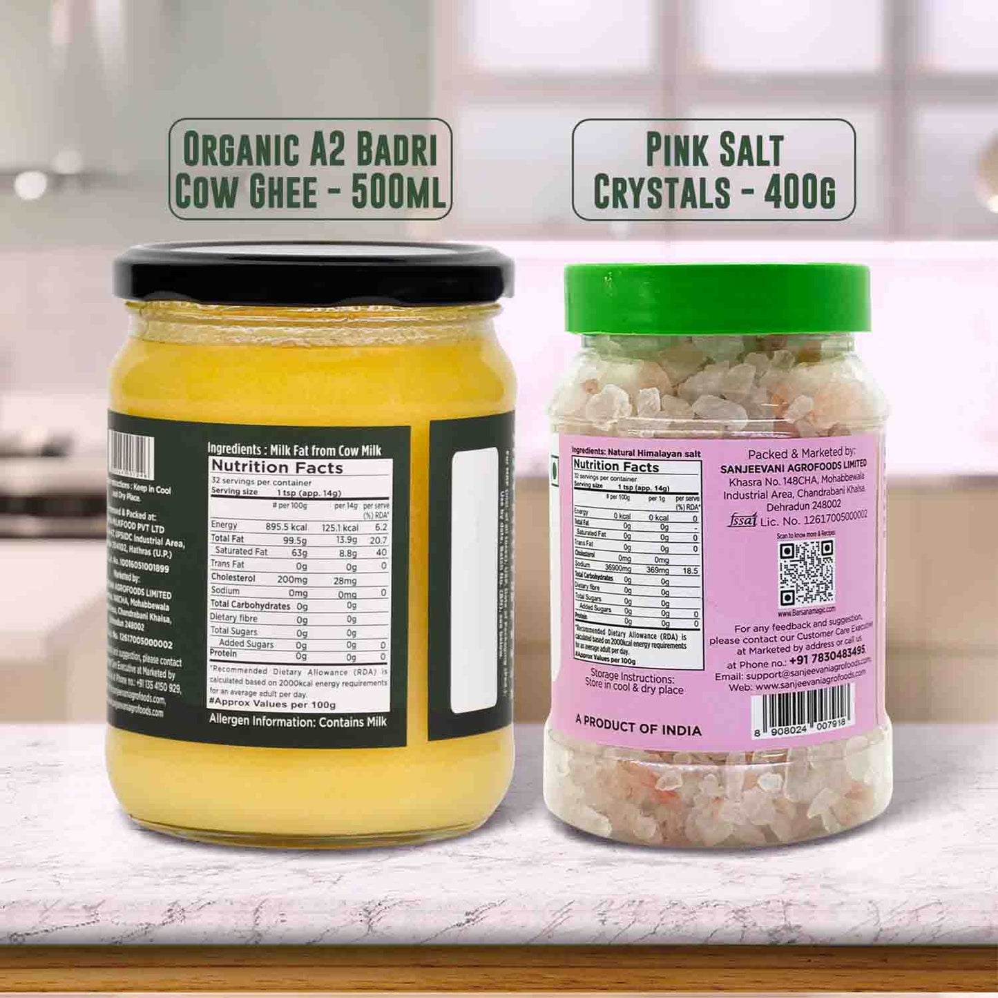 Barsana Magic and Two jars, one with yellow contents and the other with pink salt crystals, on a kitchen counter.