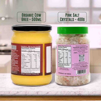 Barsana Magic and Two jars labeled 'Organic Cow Ghee' and 'Pink Salt Crystals' on a kitchen counter.