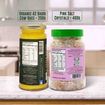 Barsana Magic and Two containers labeled 'Organic A2 Badri Cow Ghee' and 'Pink Salt Crystals' on a kitchen counter.