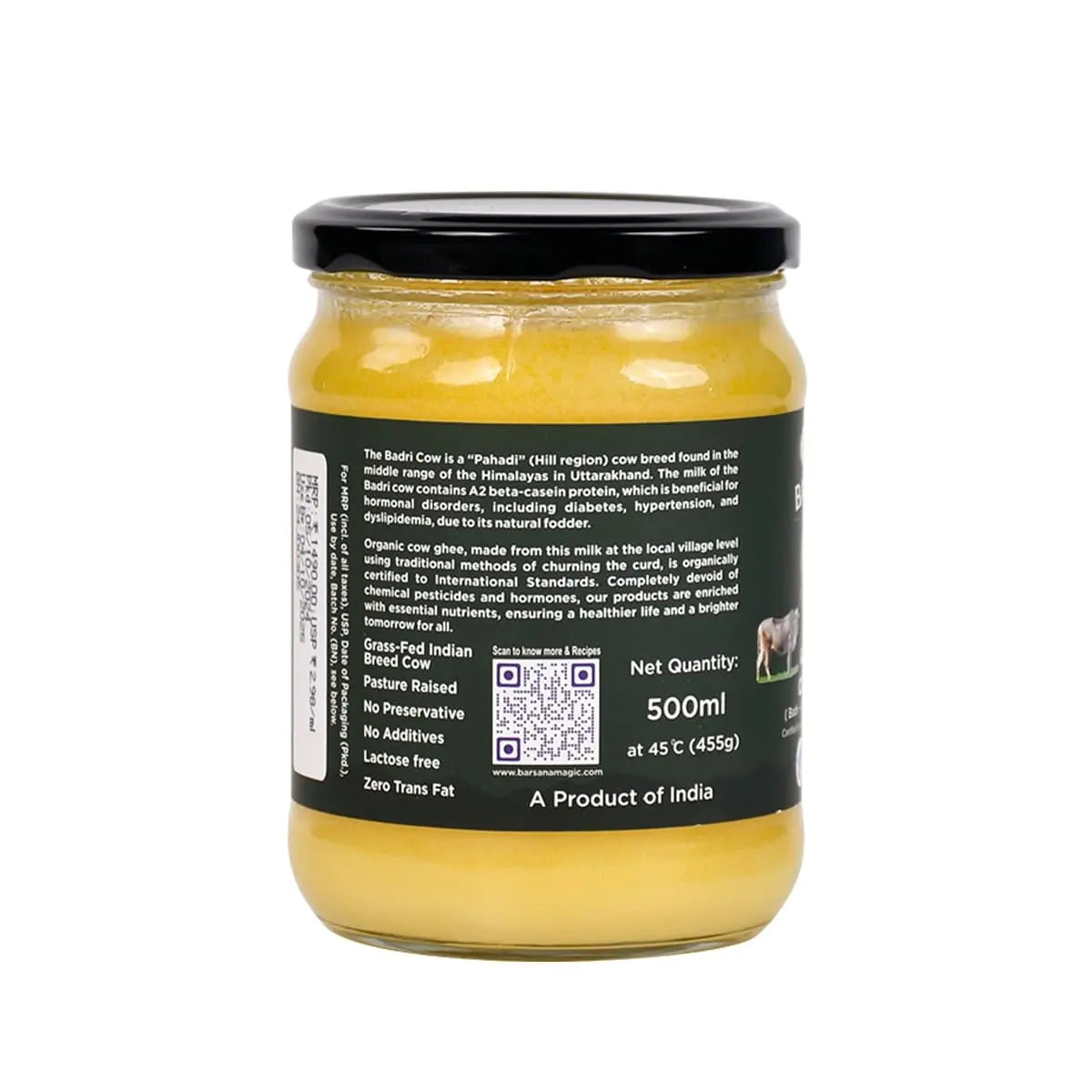 Jar of yellow spread with black label on a white background