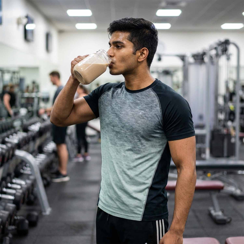 Barsana Magic and Man drinking a protein shake in a gym setting