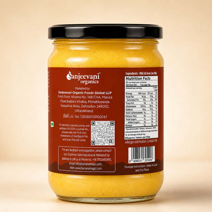 Barsana Magic and A glass jar of Sanjeevani Organics Whole Almond Flour (Khoya) with a black lid, showing the back label with nutritional facts and text, set against a solid beige background.