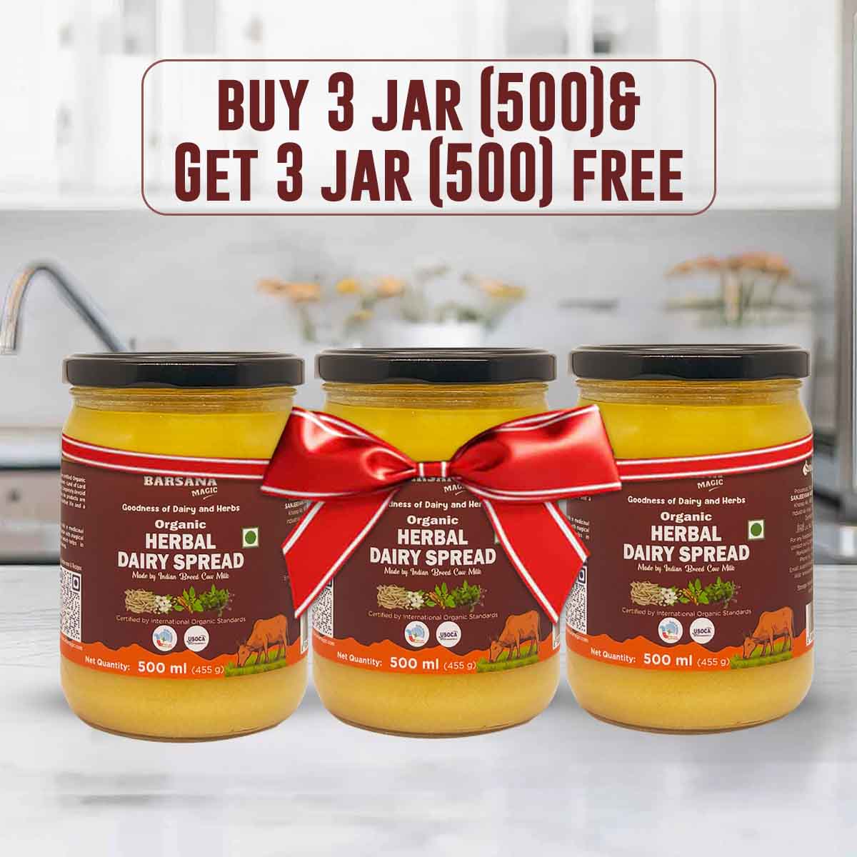 Barsana Magica and Three jars of organic herbal dairy spread with a red bow on a kitchen counter.