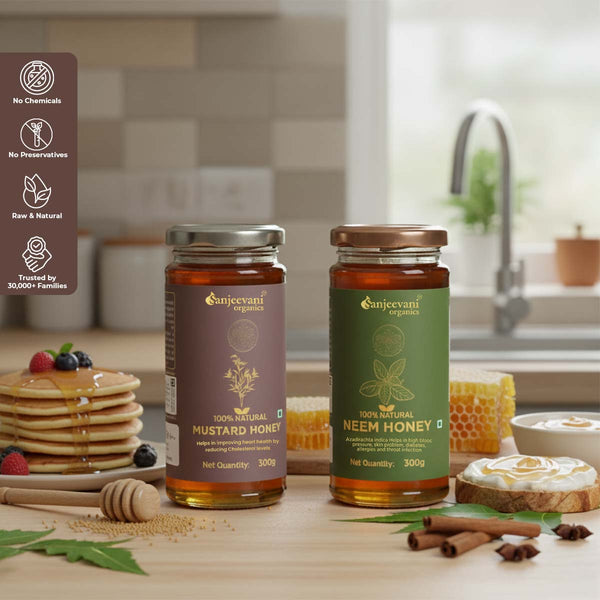 Barsana Magic and Two jars of honey from Sanjeevani Organics on a kitchen counter with pancakes and berries.
