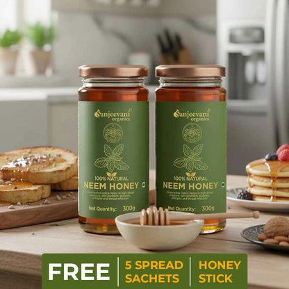 Barsana Magic and Two jars of Sanjeevani Neem Honey on a kitchen counter with breakfast items.