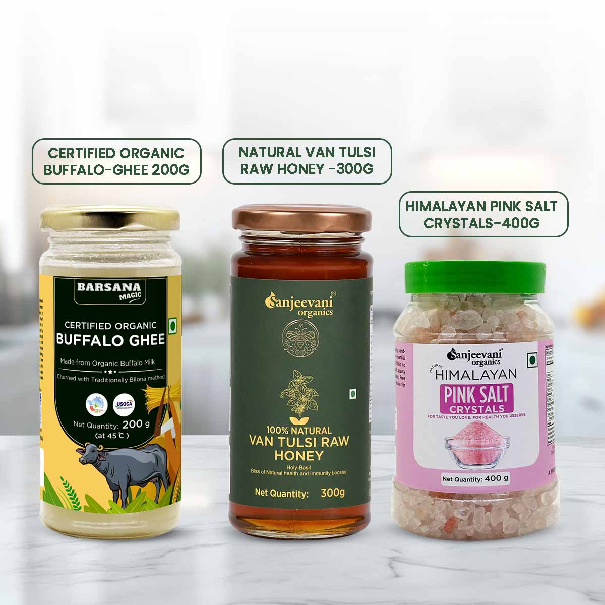 Barsana Magic and Three health products including buffalo ghee, van tulsi raw honey, and himalayan pink salt crystals on a white background.