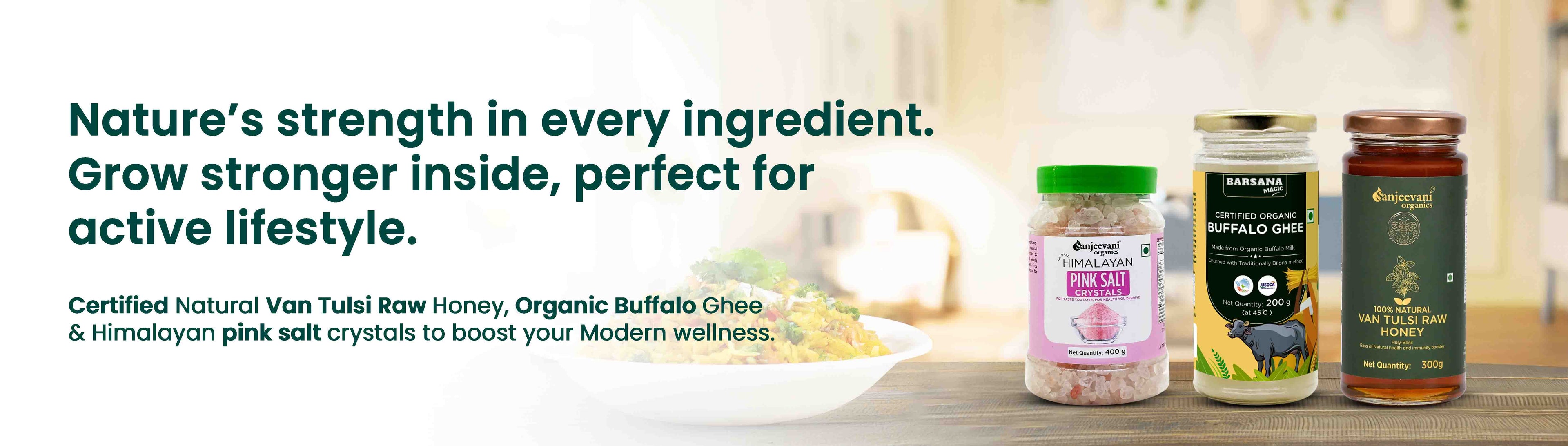 Barsana Magic and Three jars of natural products on a wooden surface with a blurred background