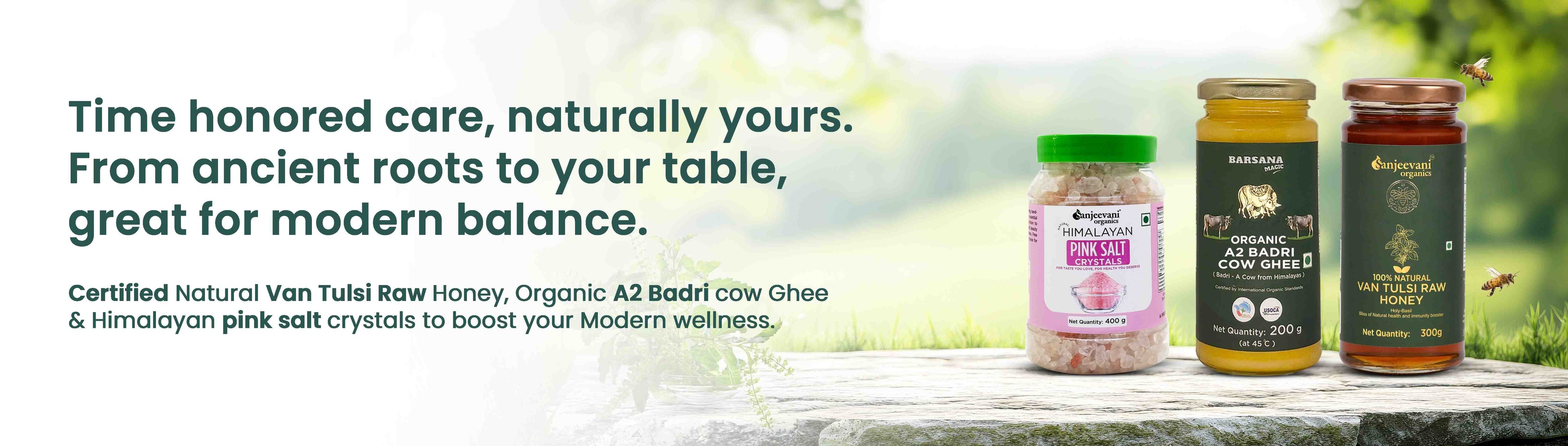 Barsana Magic and Three jars of organic products on a wooden surface with a blurred natural background