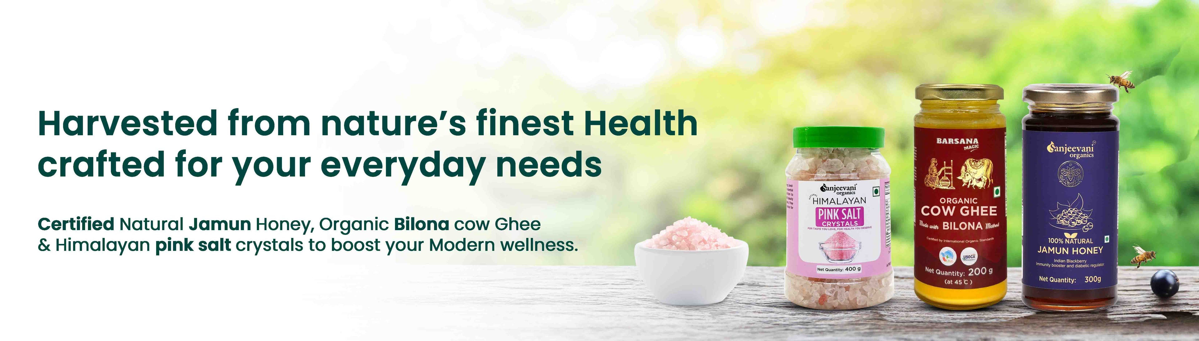 Barsana Magic and Three jars of health products on a wooden surface with a blurred green background