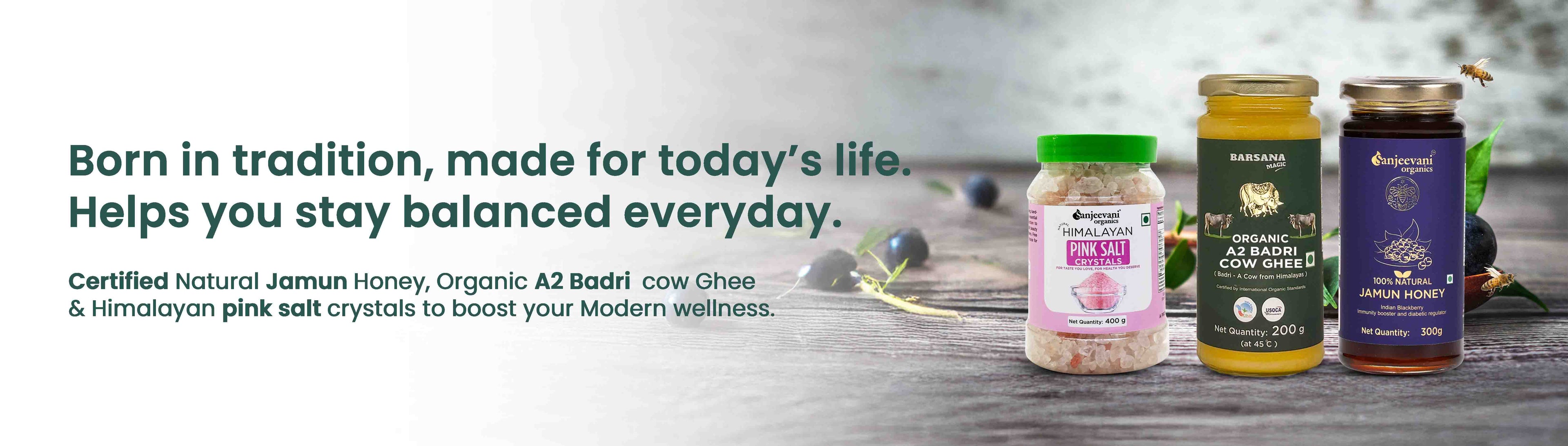 Barsana Magic and Three jars of honey and salt on a wooden surface with text about natural and organic products.