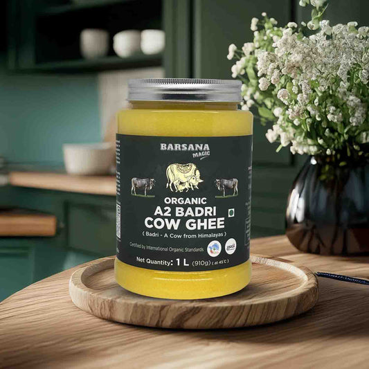 Barsana Magic and Jar of Barsana Organic A2 Badri Cow Ghee on a wooden surface with a blurred background 