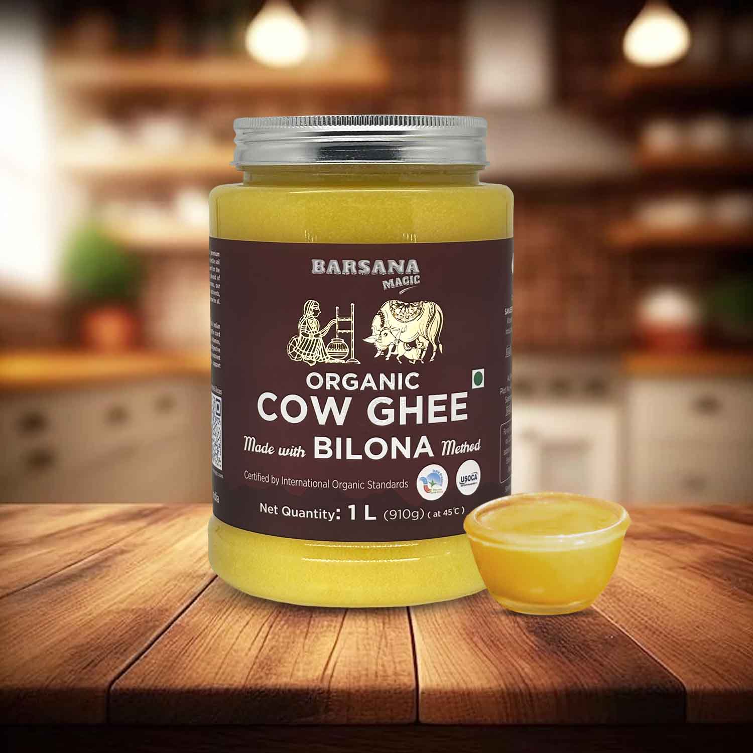 Barsana Magic and Jar of Organic Cow Ghee on a wooden surface with a blurred kitchen background