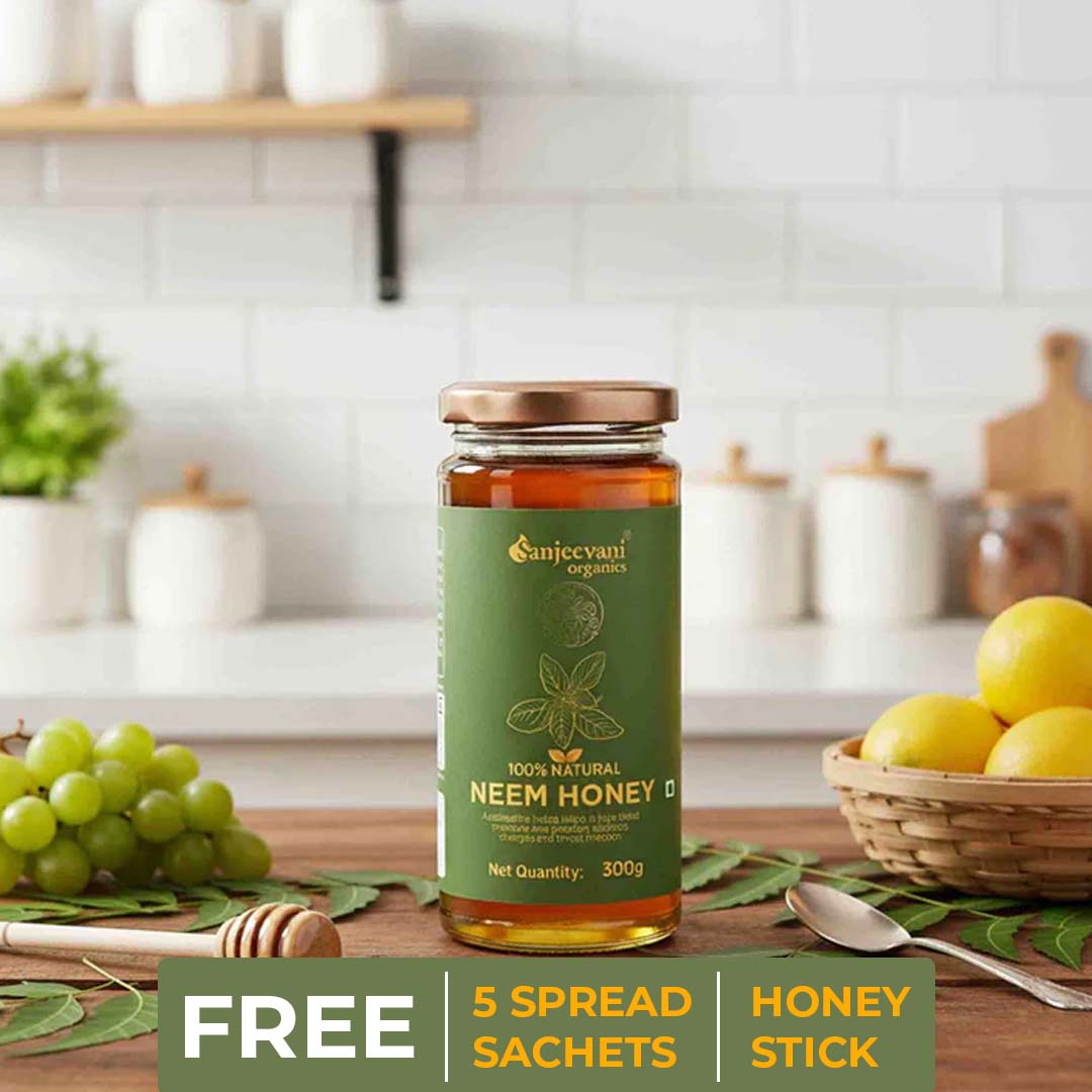 Barsana Magic and Jar of Sanjeevani Neem Honey on a kitchen counter with fruits and utensils in the background.