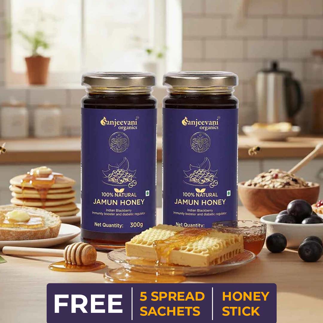 Barsana Magic and Two jars of Sanjeevani Organics Jamun Honey on a kitchen counter with waffles and honey.