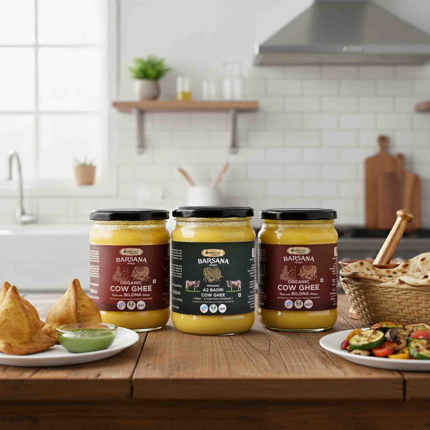 Barsana Magic and Three jars of ghee on a kitchen counter with food items around