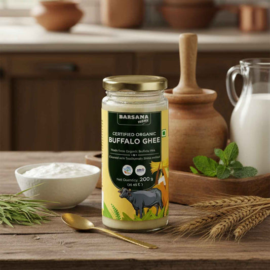 Barsana Magic and Jar of Barsana Organic Buffalo Ghee on a wooden table with kitchen items in the background