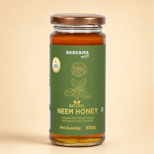 Barsana Magic and A 300g glass jar of Barsana Magic Natural Neem Honey, featuring a dark green label with gold text and illustrations, topped with a metallic bronze lid, set against a solid beige background.