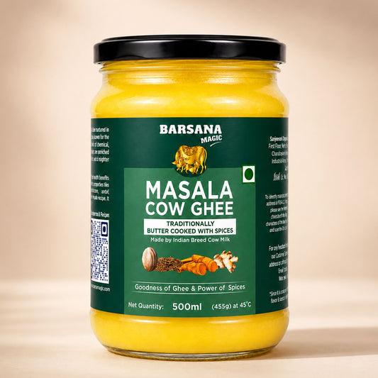 Barsana Magic and A 500ml glass jar of Barsana Magic Masala Cow Ghee, filled with bright yellow ghee and featuring a dark green label with a black lid, set against a warm beige background.