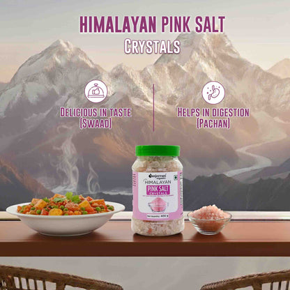 Barsana Magic and Himalayan pink salt crystals with a mountainous background