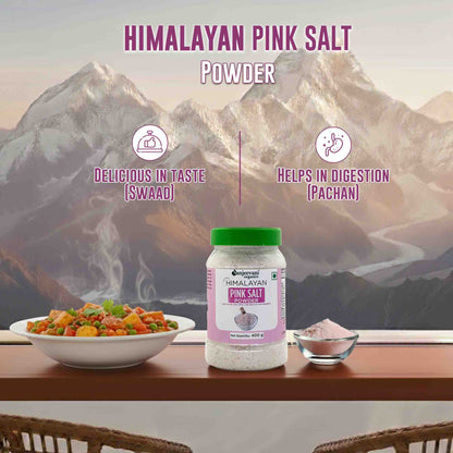 Barsana Magic and Himalayan pink salt powder with a bowl of salad and mountain background
