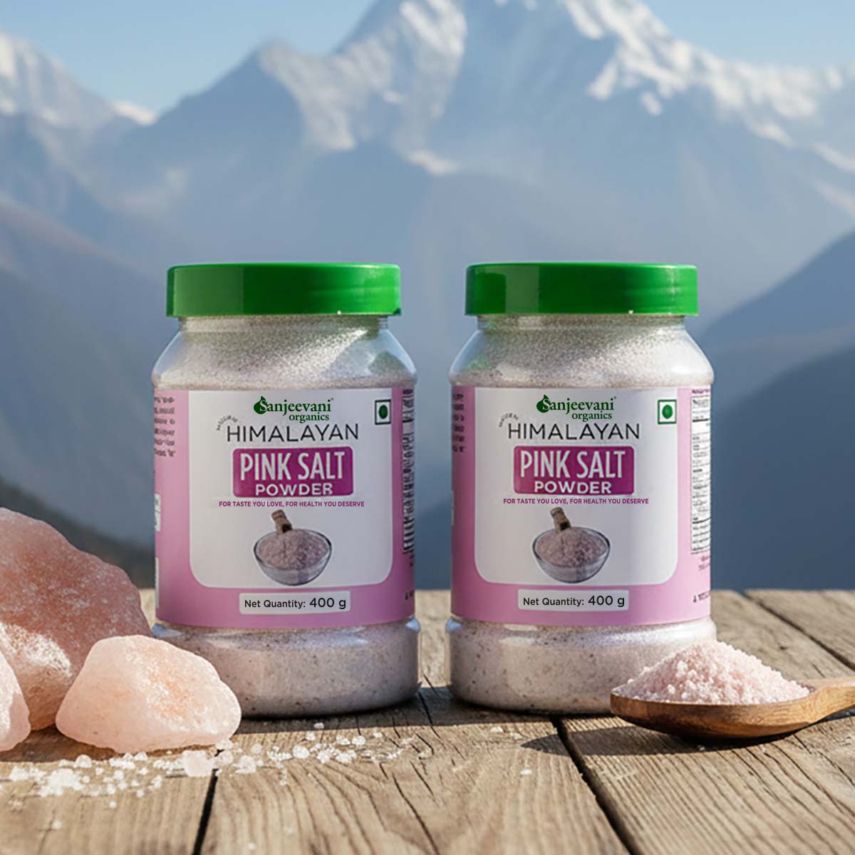 Barsana Magic and Two jars of Himalayan pink salt powder with a mountainous background
